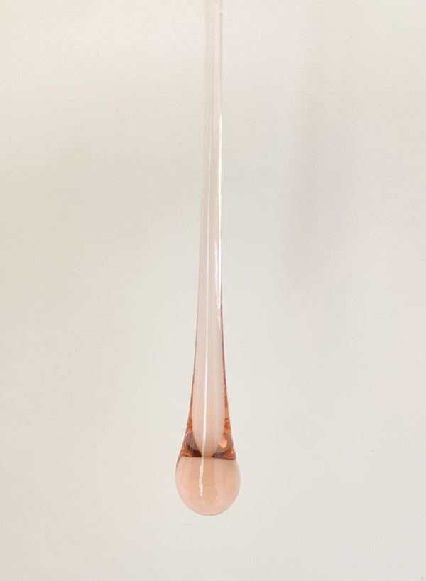 Rose gold pendant on a white background