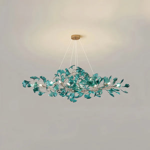 Decorative ceiling light fixture with leaf-like design on a plain background