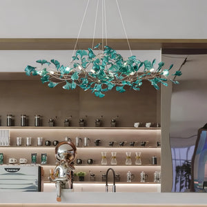 Modern green ginkgo chandelier with leaf-like design for kitchen counter.