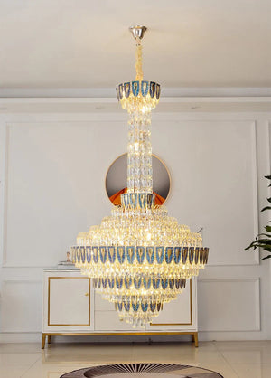 Elegant foyer space with oversized crystal chandelier centerpiece