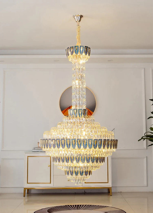 Elegant foyer space with oversized crystal chandelier centerpiece