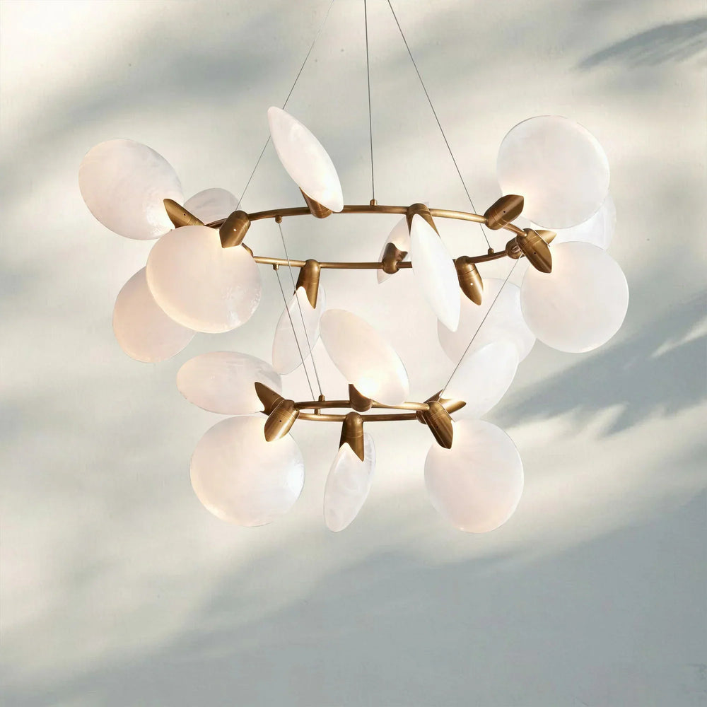 Dining room illuminated by Lyla 2-Tiered Halo Chandelier with soft ambient lighting